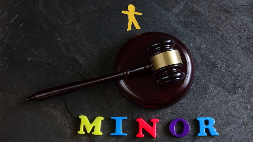 juvenile criminal defense graphic of the word minor below a gavel